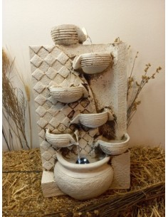 Fuente cacharro pared